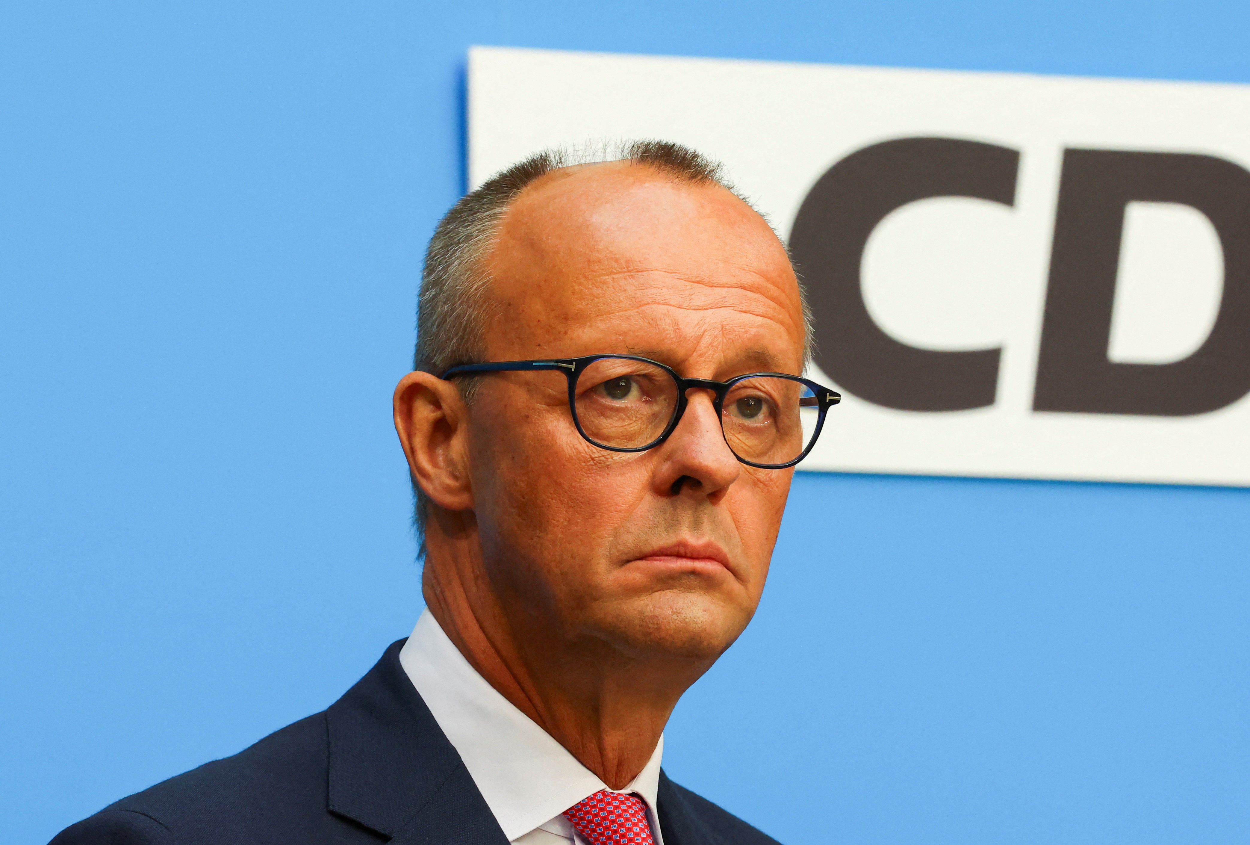 FILE PHOTO: Christian Democratic Union (CDU) leader Friedrich Merz looks on during a press conference with Bavarian State Prime Minister Markus Soeder of the Christian Social Union (CSU) in Berlin, Germany, September 17, 2024. REUTERS/Fabrizio Bensch/File Photo